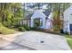 Charming light blue home features a well-kept front yard, bay window, and inviting curb appeal at 6 Landover Ct, Durham, NC 27713