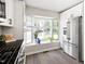 Bright kitchen with large bay window and stainless steel refrigerator at 6 Landover Ct, Durham, NC 27713