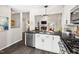 Open-concept kitchen view into the living room with stainless steel dishwasher and appliances at 6 Landover Ct, Durham, NC 27713