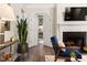 Living room with blue accent chair, fireplace, and archway at 6 Landover Ct, Durham, NC 27713