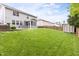 A spacious, well-manicured backyard with a screened porch, hot tub, and a shed at 609 Conover Rd, Durham, NC 27703