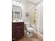 Cozy bathroom featuring neutral finishes, a tub-shower combination, and a wood vanity at 609 Conover Rd, Durham, NC 27703