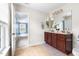 Double sink vanity in the Primary bath, features a tile floor and plenty of counter space at 609 Conover Rd, Durham, NC 27703