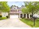 Attractive home with stone accents, red shutters, and a well-manicured front lawn at 609 Conover Rd, Durham, NC 27703
