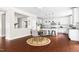 Kitchen connects to the dining area, featuring white cabinets and stainless steel appliances at 609 Conover Rd, Durham, NC 27703