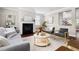 Cozy living room with a fireplace, neutral tones, and modern decor at 609 Conover Rd, Durham, NC 27703
