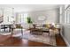 Open-concept living room featuring stylish decor, hardwood flooring, and modern design at 609 Conover Rd, Durham, NC 27703