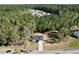 Aerial view of the home surrounded by lush greenery, showcasing its neighborhood setting at 61 Okra Ct, Selma, NC 27576