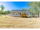 View of the home's backyard and wooden deck, perfect for enjoying the outdoors at 61 Okra Ct, Selma, NC 27576