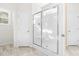 Bathroom with glass enclosed shower, featuring light tile flooring at 61 Okra Ct, Selma, NC 27576