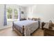 Comfortable bedroom with wood floors and a large window with natural light at 61 Okra Ct, Selma, NC 27576