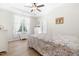 Bedroom with tray ceiling, ceiling fan, and bright windows at 61 Okra Ct, Selma, NC 27576