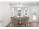 Charming dining area featuring a round table, upholstered chairs, and bay windows with natural light at 61 Okra Ct, Selma, NC 27576