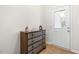 Charming entryway featuring a decorative chest and a glass-paneled front door at 61 Okra Ct, Selma, NC 27576