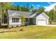 Charming one-story home featuring a two-car garage and beautifully landscaped front yard at 61 Okra Ct, Selma, NC 27576