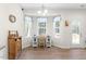Bright eat-in kitchen featuring wood floors and desk area with views of the outdoors at 61 Okra Ct, Selma, NC 27576