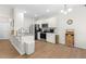 Well-lit kitchen with white cabinetry, stainless steel appliances, and granite countertops at 61 Okra Ct, Selma, NC 27576