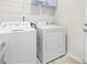 Convenient laundry room featuring a washer and dryer and ample space at 61 Okra Ct, Selma, NC 27576