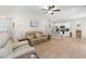 Open-concept living room with a kitchen bar and lots of natural light at 61 Okra Ct, Selma, NC 27576