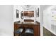 Stylish bar area with elegant cabinetry, granite countertops, and seating for two at 6212 Trevor Ct, Raleigh, NC 27613