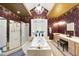 The luxurious bathroom features a large tub, shower, and stylish fixtures at 6212 Trevor Ct, Raleigh, NC 27613