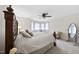 Bedroom with carpeted floors, large windows with sheer curtains, and a decorative metal bed frame at 6212 Trevor Ct, Raleigh, NC 27613