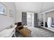 Bright bedroom includes a vanity with leopard print chaise and large window at 6212 Trevor Ct, Raleigh, NC 27613
