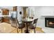 Cozy dining area featuring hardwood floors, a modern fireplace and natural light at 6212 Trevor Ct, Raleigh, NC 27613