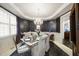 Formal dining room with decorative wallpaper, chandelier, and seating for six at 6212 Trevor Ct, Raleigh, NC 27613