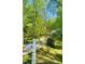 Long driveway leading to a secluded home with mature trees and a white mailbox at 6212 Trevor Ct, Raleigh, NC 27613