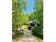 Beautiful brick home with a well manicured lawn and bridge leading up to the house at 6212 Trevor Ct, Raleigh, NC 27613