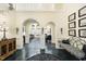 Elegant foyer with archways, chandelier, and black-and-white patterned bench seating at 6212 Trevor Ct, Raleigh, NC 27613