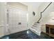 Grand foyer with a staircase, chandelier, high ceilings, and decorative tile flooring at 6212 Trevor Ct, Raleigh, NC 27613