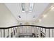 Bright foyer boasts a high ceiling, skylights, chandelier, and elegant staircase at 6212 Trevor Ct, Raleigh, NC 27613