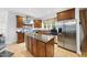 Beautiful kitchen with a stainless steel fridge, modern appliances, and a center island at 6212 Trevor Ct, Raleigh, NC 27613