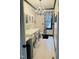 Well-lit laundry room featuring a washer, dryer, countertop, cabinets, and tiled flooring at 6212 Trevor Ct, Raleigh, NC 27613