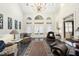 Spacious living room with high ceilings, skylights, and a grand chandelier at 6212 Trevor Ct, Raleigh, NC 27613