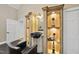 Home salon station with sink, chair, and shelving at 6212 Trevor Ct, Raleigh, NC 27613