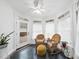 Bright sunroom featuring wicker chairs, plants, and windows for natural light at 6212 Trevor Ct, Raleigh, NC 27613