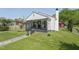 Exterior view of home featuring lawn and cozy front porch at 729 S Carolina Ave, Henderson, NC 27536