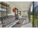 Cozy front porch with a comfortable bench and swing at 729 S Carolina Ave, Henderson, NC 27536