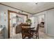 Open kitchen and living area featuring plank flooring and neutral colors at 729 S Carolina Ave, Henderson, NC 27536