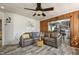 Spacious living room featuring plank flooring, neutral walls, and a comfortable sectional sofa at 729 S Carolina Ave, Henderson, NC 27536