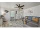 Inviting living room with plank flooring, neutral walls, and a comfortable sectional sofa at 729 S Carolina Ave, Henderson, NC 27536
