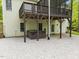 A covered back patio features a stone floor and a hot tub for outdoor relaxation and entertaining at 733 Holding Ridge Ct, Wake Forest, NC 27587