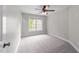 Bedroom with neutral walls, carpet flooring, ceiling fan, and natural light at 733 Holding Ridge Ct, Wake Forest, NC 27587