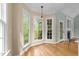 Sunny breakfast nook with large windows and hardwood floors at 733 Holding Ridge Ct, Wake Forest, NC 27587