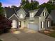 Charming two-story home featuring a neutral color palette, well-manicured landscaping, and an attached two-car garage at 733 Holding Ridge Ct, Wake Forest, NC 27587