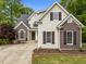 A beautiful two-story home boasting a well-manicured lawn, an elegant design, and a welcoming front entrance at 733 Holding Ridge Ct, Wake Forest, NC 27587