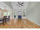Bright living room featuring a fireplace, wood floors, and a ceiling fan at 733 Holding Ridge Ct, Wake Forest, NC 27587